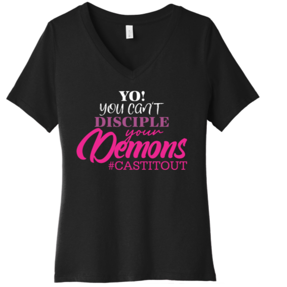 Black V-neck T-shirt with bold text reading "Yo! You can't disciple your demons #CASTITOUT" in white, purple, and pink lettering.